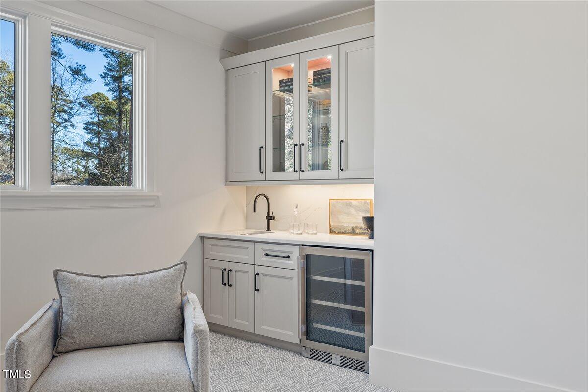 7516 Grist Mill Road Raleigh, NC 27615 - Photo 55 of 83 a bathroom with a sink and a mirror