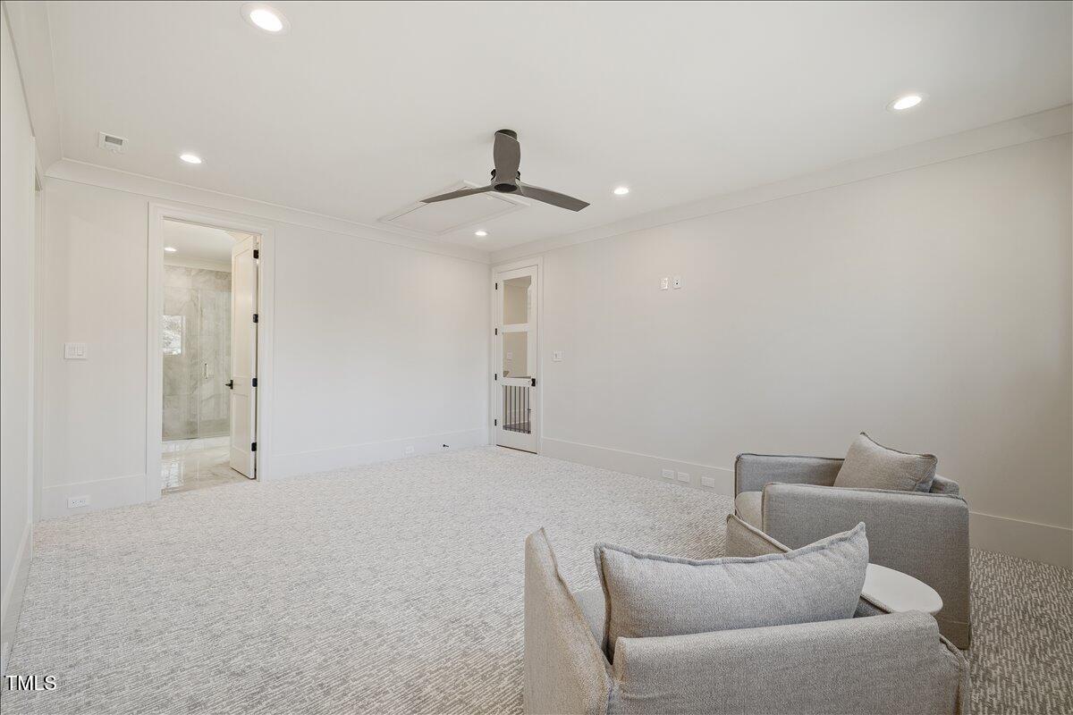 7516 Grist Mill Road Raleigh, NC 27615 - Photo 56 of 83 a living room with furniture and a ceiling fan