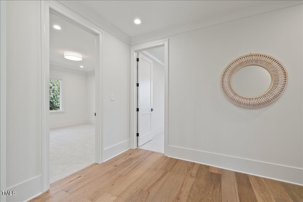 7516 Grist Mill Road Raleigh, NC 27615 - Photo 63 of 83 a view of a room with wooden floor and bathroom
