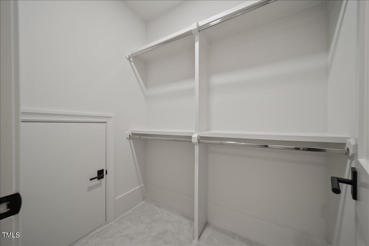 7516 Grist Mill Road Raleigh, NC 27615 - Photo 68 of 83 a view of a walk in closet