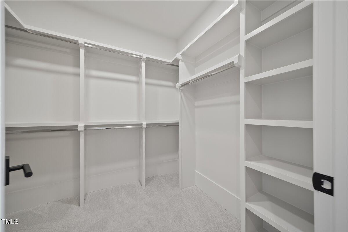 7516 Grist Mill Road Raleigh, NC 27615 - Photo 73 of 83 a view of an empty walk in closet