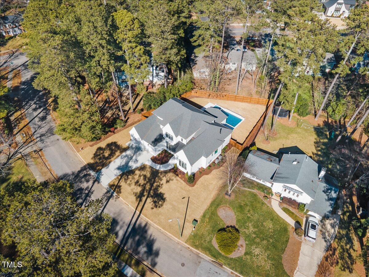 7516 Grist Mill Road Raleigh, NC 27615 - Photo 79 of 83 an aerial view of a house with garden space and trees