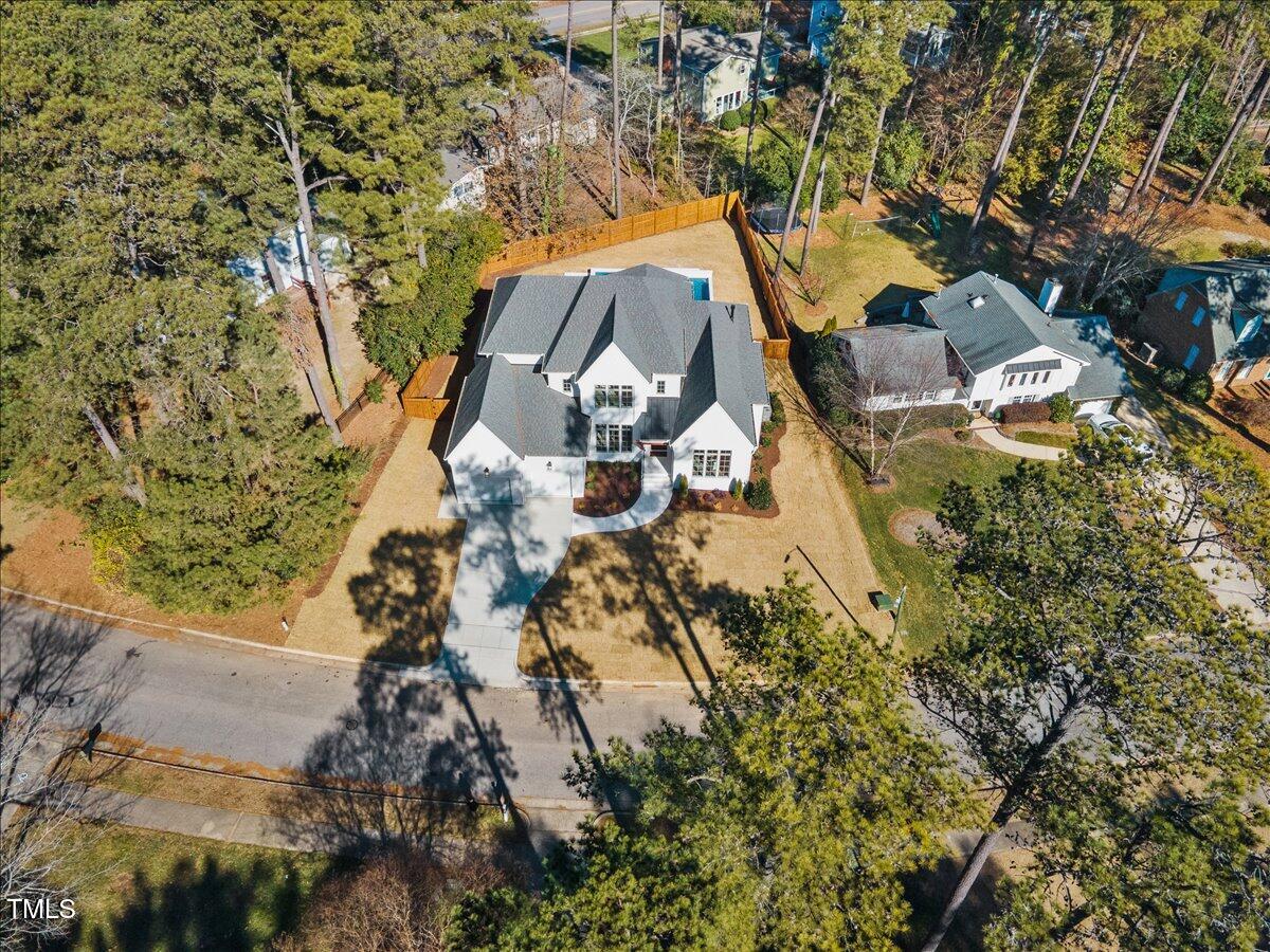 7516 Grist Mill Road Raleigh, NC 27615 - Photo 80 of 83 an aerial view of a house with yard and parking
