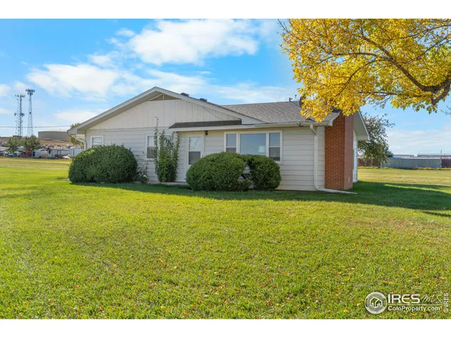 a view of a backyard of the house
