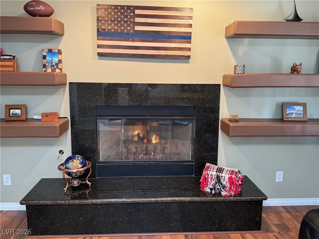 504 I Avenue Boulder City, NV 89005 - Photo 12 of 60 Detailed view of a premium fireplace and wood finished floors