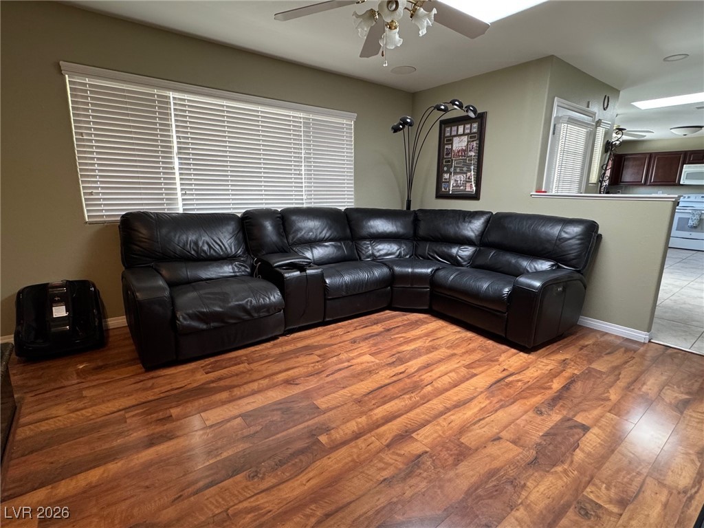504 I Avenue Boulder City, NV 89005 - Photo 13 of 60 Living room with a ceiling fan and light wood-style flooring