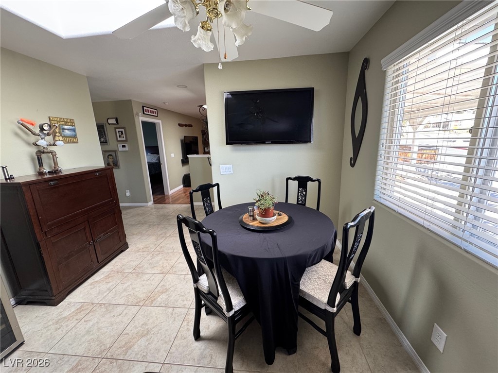 504 I Avenue Boulder City, NV 89005 - Photo 16 of 60 Dining space with light tile patterned floors and a ceiling fan