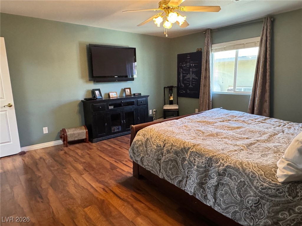 504 I Avenue Boulder City, NV 89005 - Photo 22 of 60 Bedroom featuring dark wood-style floors and a ceiling fan