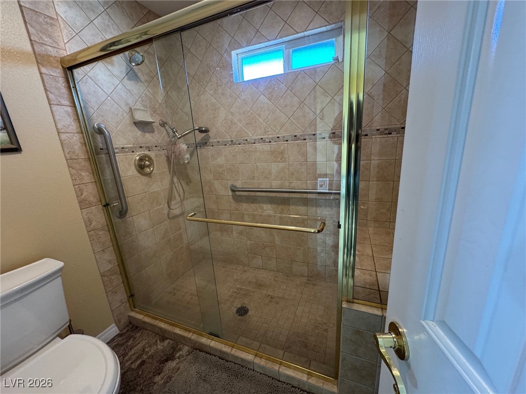 504 I Avenue Boulder City, NV 89005 - Photo 27 of 60 Bathroom featuring a shower stall and a textured wall