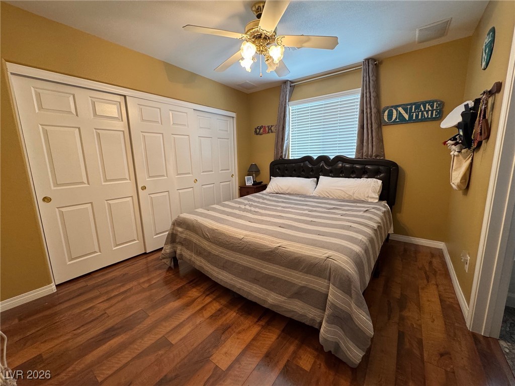 504 I Avenue Boulder City, NV 89005 - Photo 31 of 60 Bedroom featuring dark wood finished floors, ceiling fan, and a closet