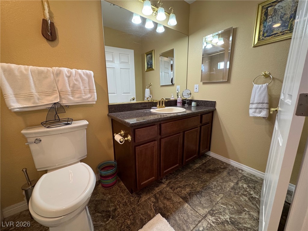504 I Avenue Boulder City, NV 89005 - Photo 35 of 60 Bathroom featuring vanity and a textured wall