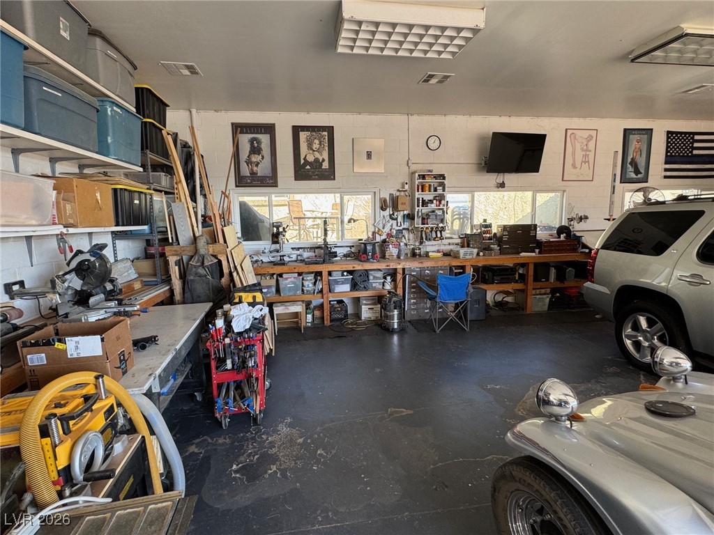 504 I Avenue Boulder City, NV 89005 - Photo 56 of 60 Garage with a workshop area and concrete block wall