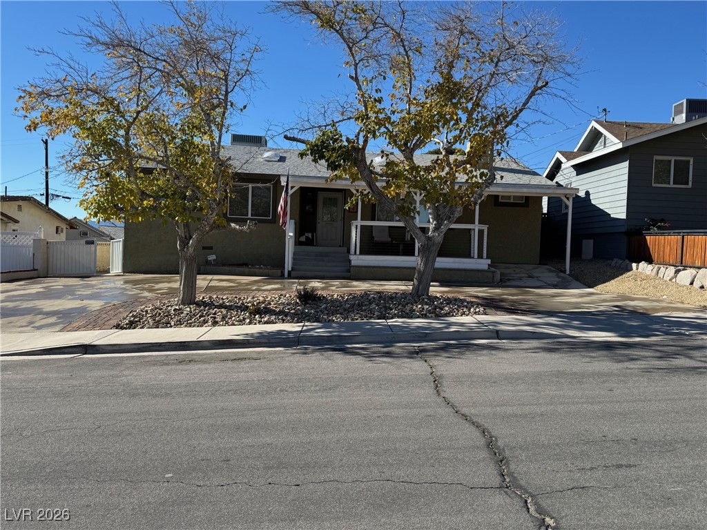 504 I Avenue Boulder City, NV 89005 - Photo 6 of 60 View of front of home featuring covered porch and a shingled roof