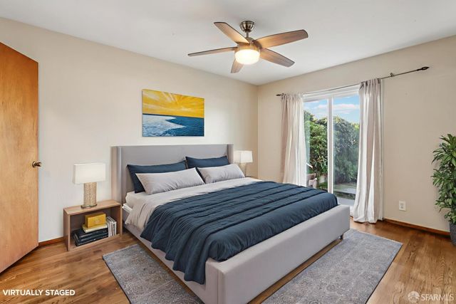 a bedroom with a large bed and a window