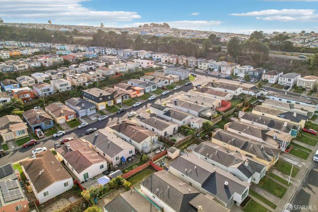 an aerial view of a city with lots of residential buildings