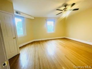 69 Harney Road, Unit 6B Scarsdale, NY 10583 - Photo 5 of 11 a view of a room with wooden floor and a window