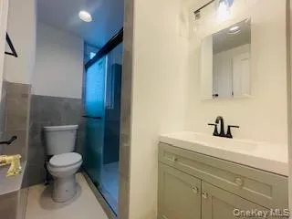 a bathroom with a toilet and a sink