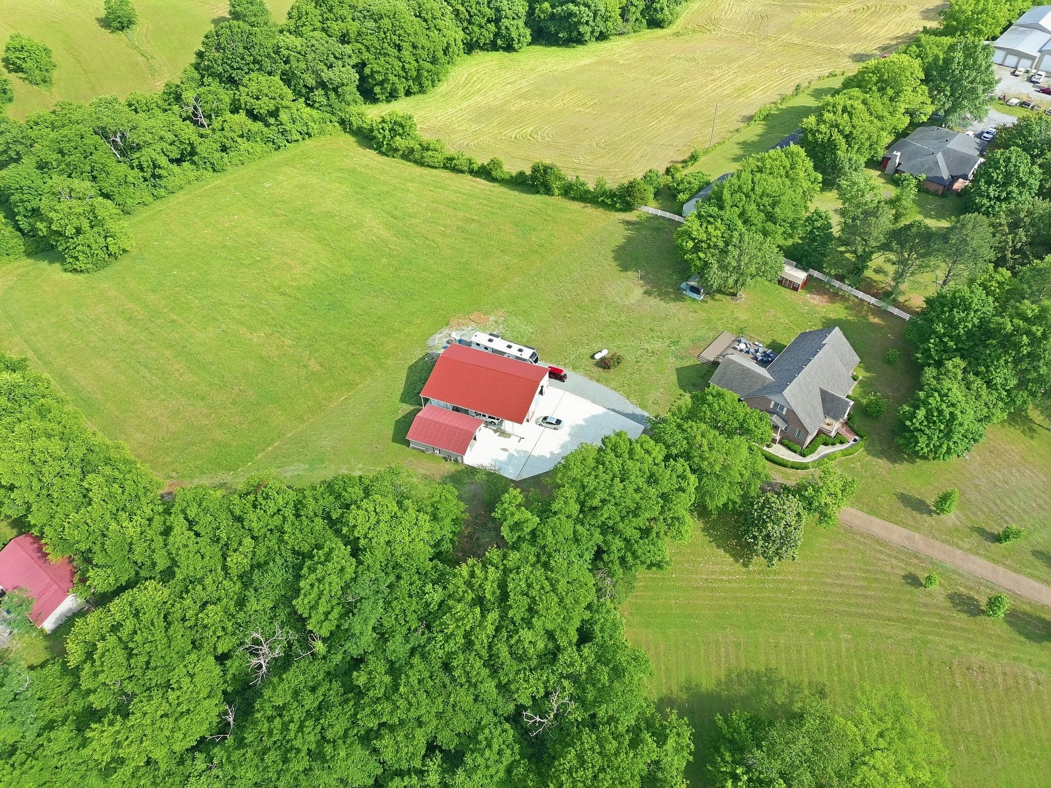 1150 Cochran Cemetery Road Lewisburg, TN 37091 - Photo 56 of 63 an aerial view of a house with a yard and lake view