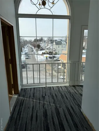 a view of wooden floor and a window