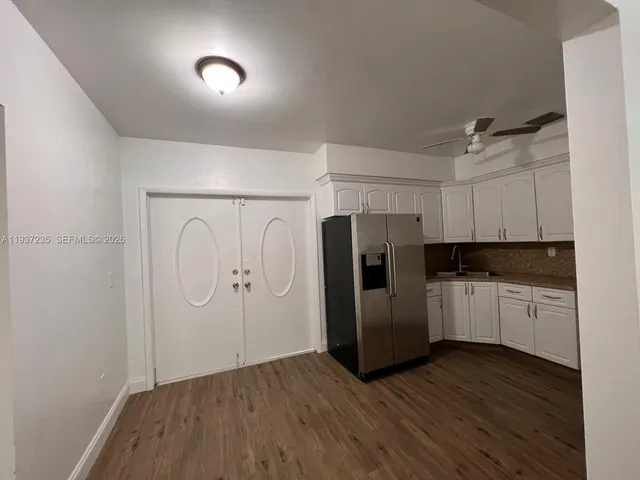 a kitchen with stainless steel appliances a refrigerator and a sink