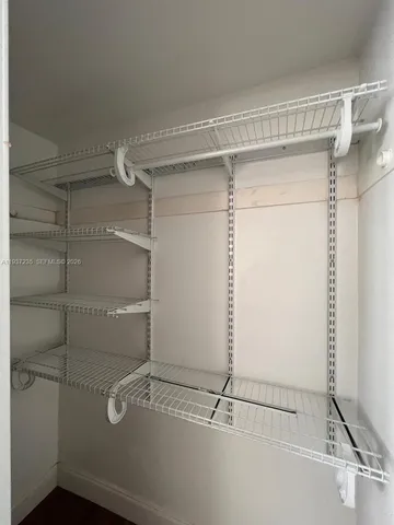 a view of a room with racks on the wall