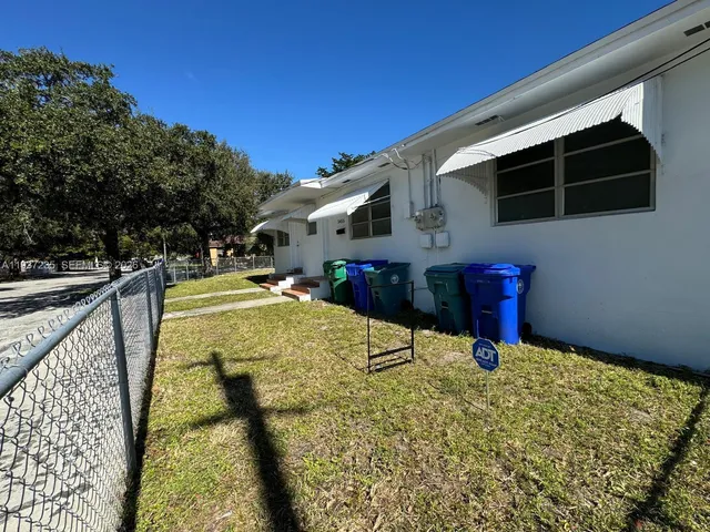 a view of an chairs and table in the balcony