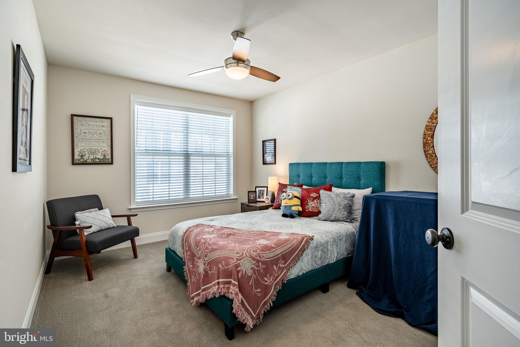 309 Murray Lane Springfield, PA 19064 - Photo 27 of 47 a bedroom with a bed couch and a window