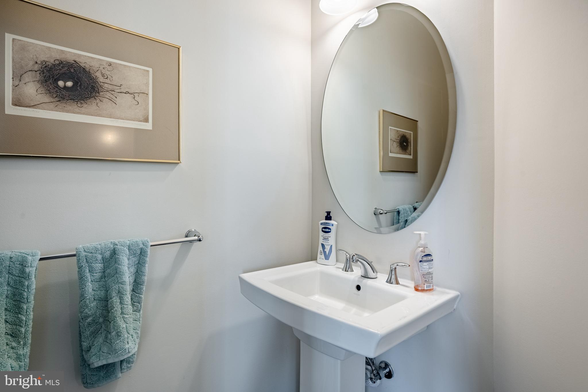 309 Murray Lane Springfield, PA 19064 - Photo 30 of 47 a bathroom with a sink and a mirror