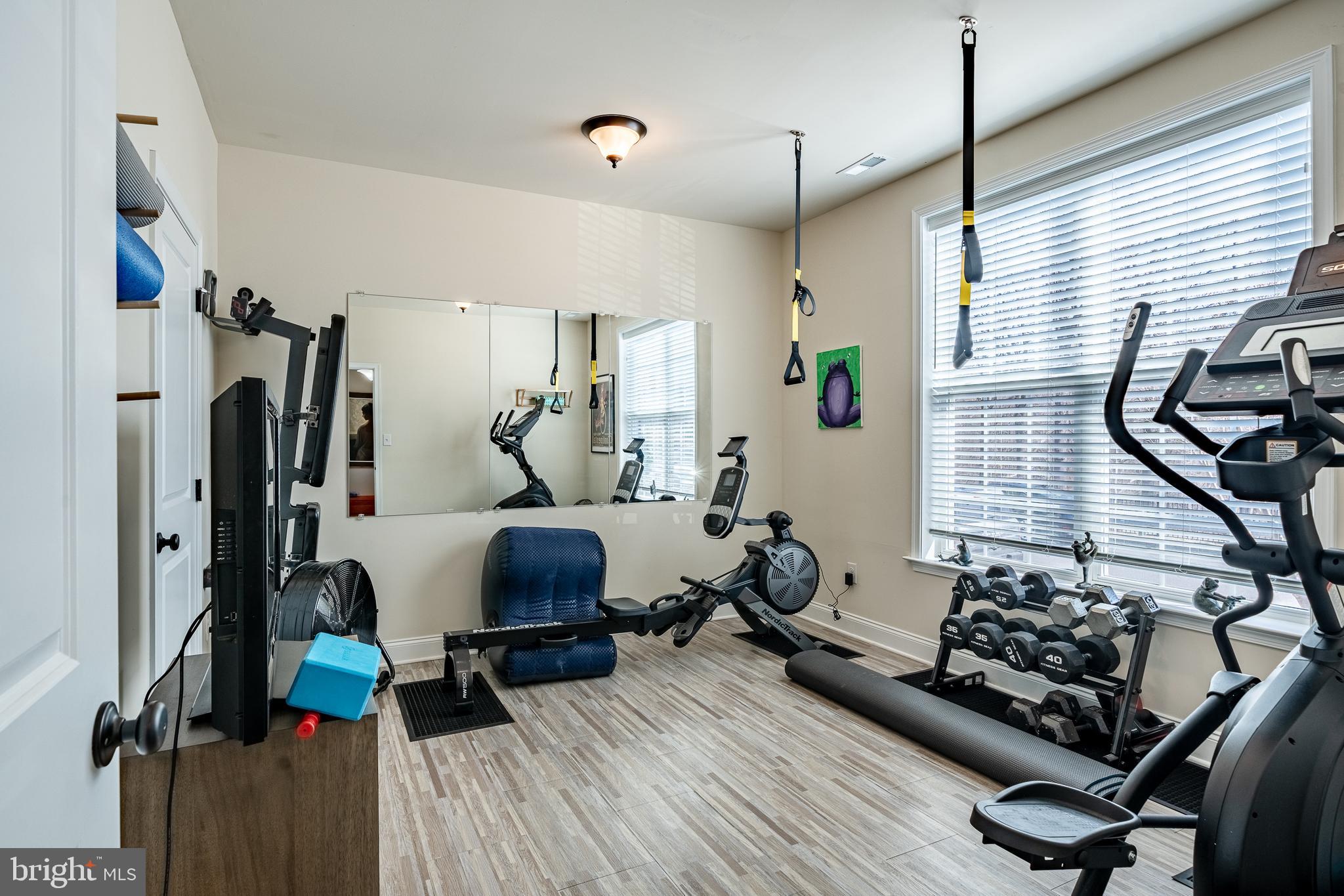 309 Murray Lane Springfield, PA 19064 - Photo 31 of 47 a room with gym equipment and a window