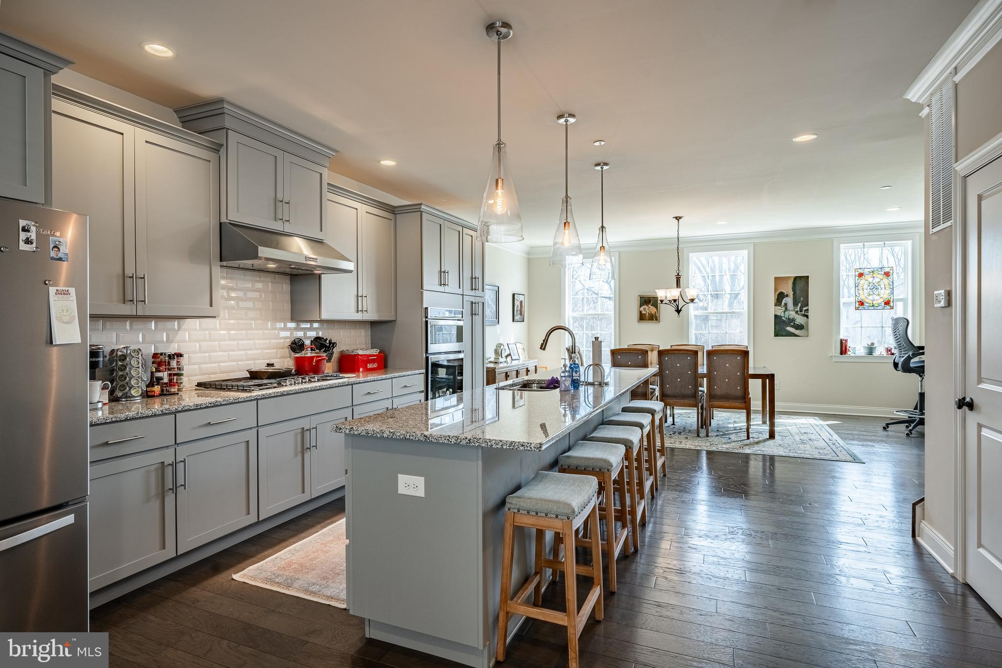 309 Murray Lane Springfield, PA 19064 - Photo 10 of 47 a room with stainless steel appliances kitchen island granite countertop a dining table chairs and sink