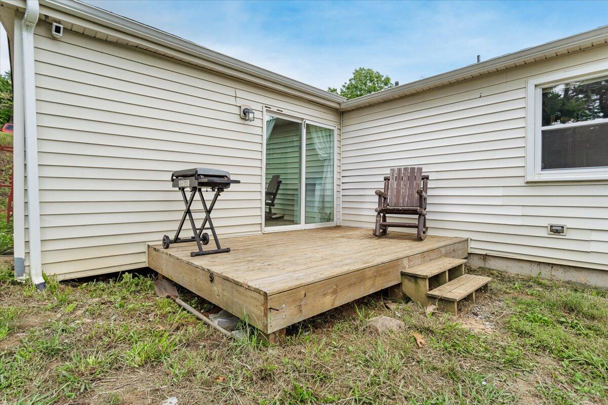 6347 Meacham Road Salem, VA 24153 - Photo 13 of 26 a house view with a backyard and wooden deck