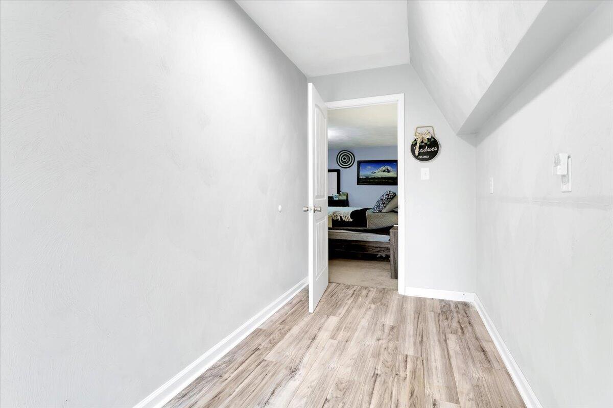 6347 Meacham Road Salem, VA 24153 - Photo 16 of 26 a view of a room with wooden floor & a ceiling fan