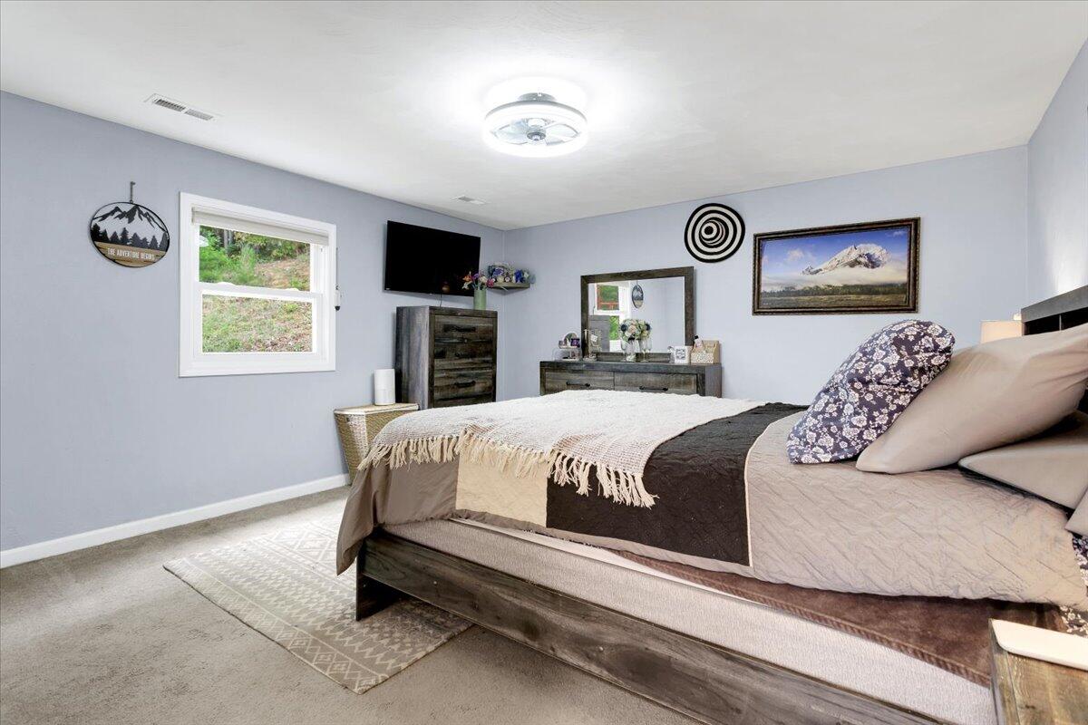 6347 Meacham Road Salem, VA 24153 - Photo 17 of 26 a bedroom with a large bed and a window