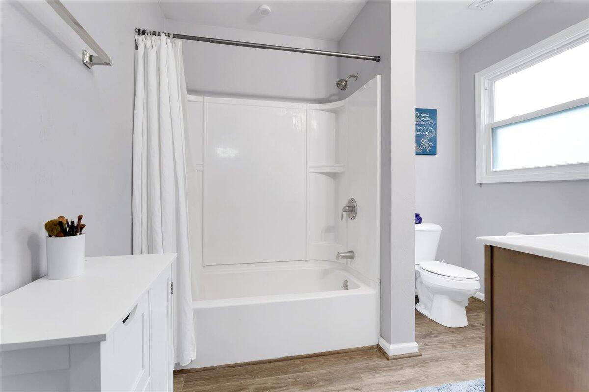 6347 Meacham Road Salem, VA 24153 - Photo 19 of 26 a bathroom with a bathtub a toilet and a shower