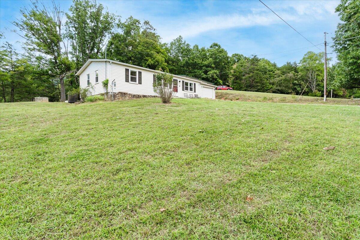 6347 Meacham Road Salem, VA 24153 - Photo 2 of 26 a house view with a garden space