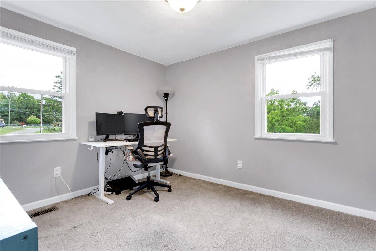 6347 Meacham Road Salem, VA 24153 - Photo 22 of 26 a view of a workspace with furniture and a window
