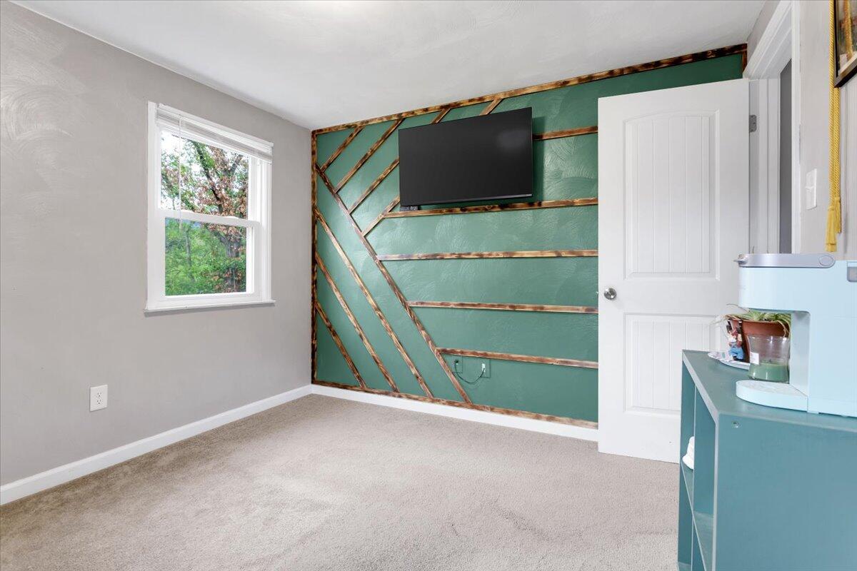 6347 Meacham Road Salem, VA 24153 - Photo 23 of 26 a room with window and flat screen tv