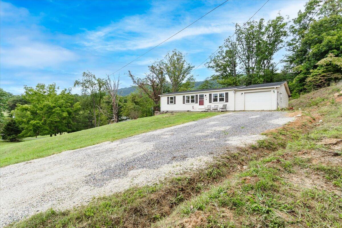 6347 Meacham Road Salem, VA 24153 - Photo 3 of 26 a front view of a house with a yard and trees