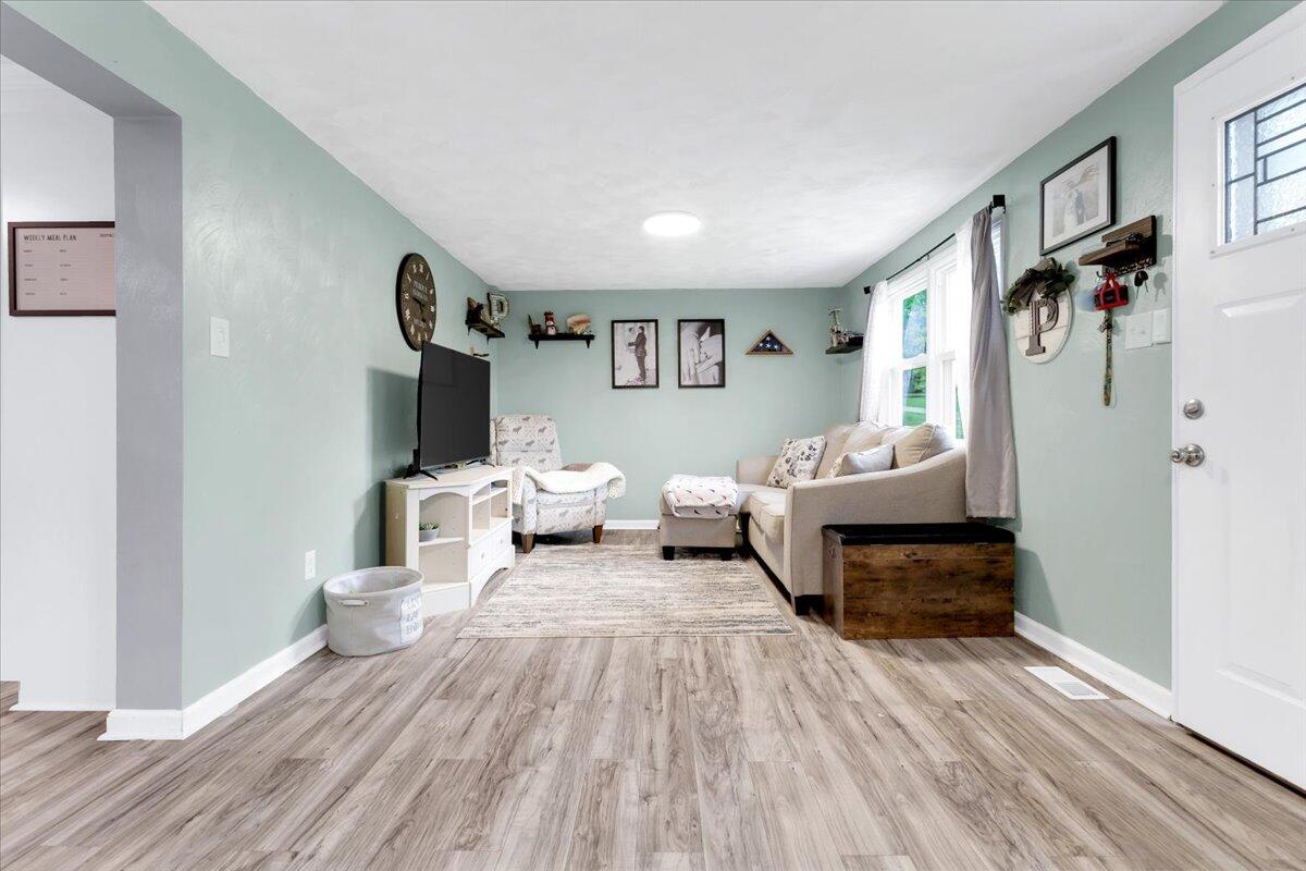 6347 Meacham Road Salem, VA 24153 - Photo 5 of 26 a living room with furniture and a wooden floor