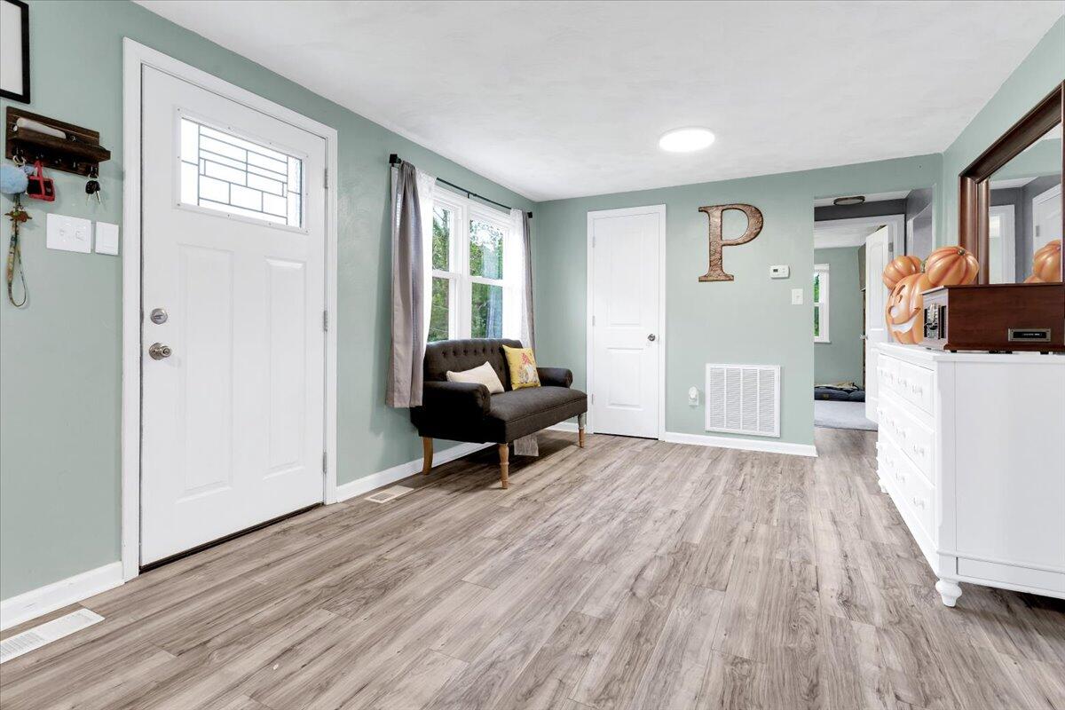 6347 Meacham Road Salem, VA 24153 - Photo 6 of 26 a living room with furniture and a wooden floor