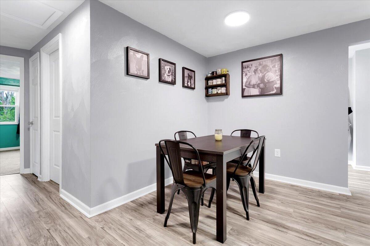 6347 Meacham Road Salem, VA 24153 - Photo 7 of 26 a view of a dining room with furniture and wooden floor