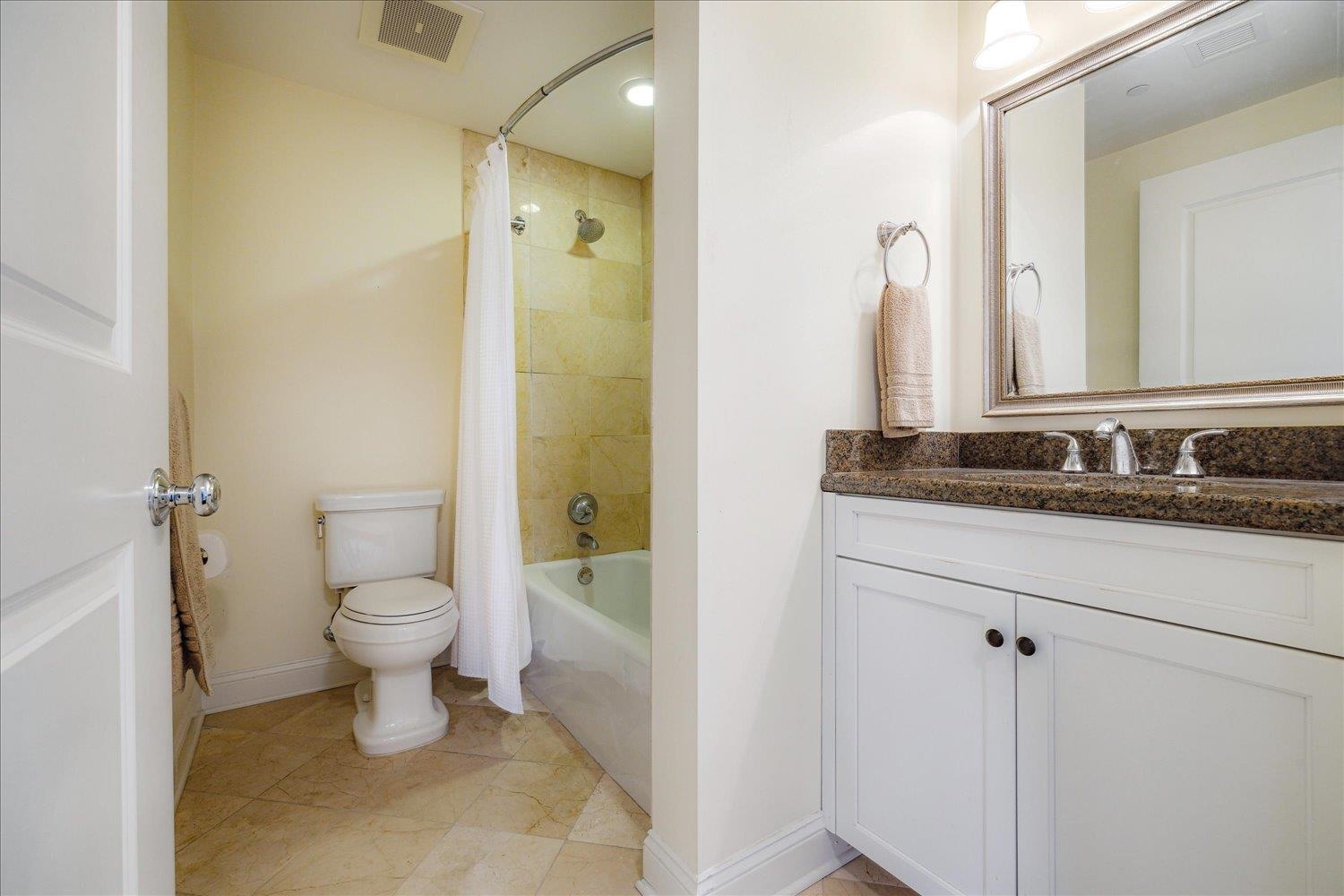 127 Madison Avenue, Unit 602 Memphis, TN 38103 - Photo 19 of 25 Bathroom with vanity and shower / tub combo with curtain