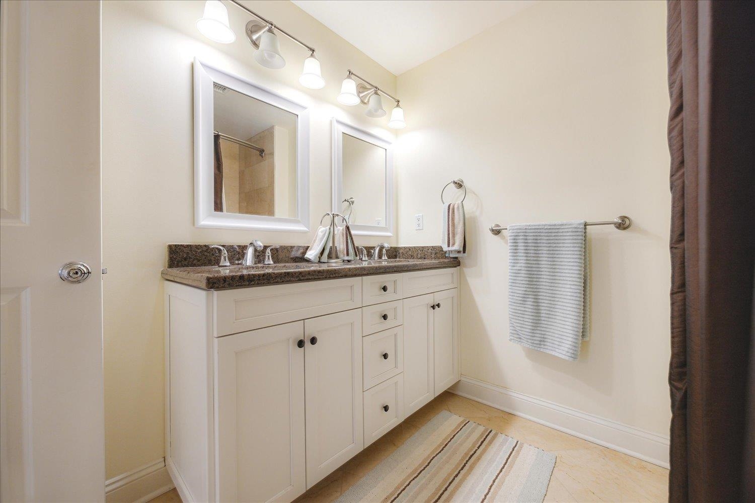 127 Madison Avenue, Unit 602 Memphis, TN 38103 - Photo 20 of 25 Full bathroom with double vanity and baseboards