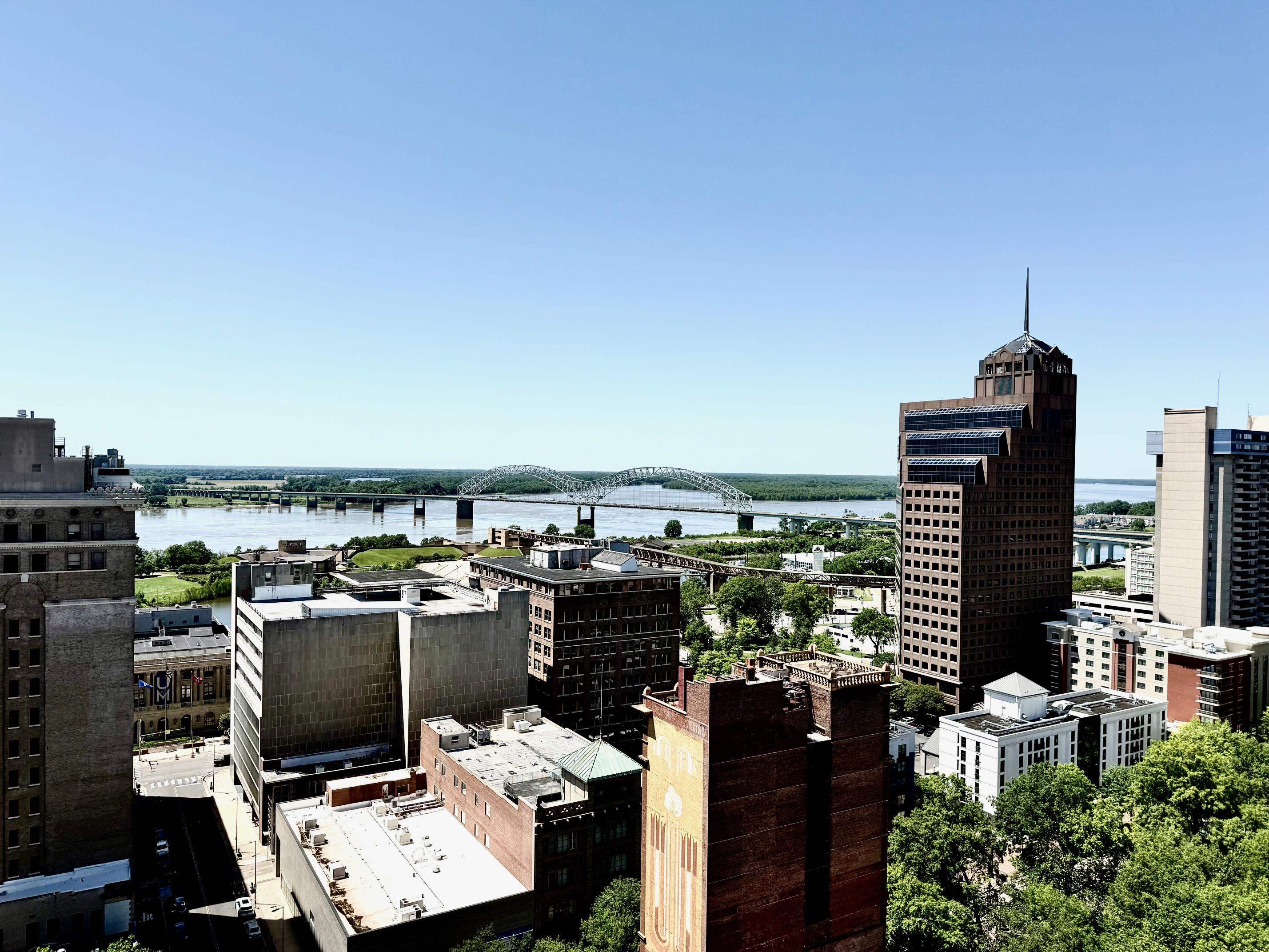 127 Madison Avenue, Unit 602 Memphis, TN 38103 - Photo 8 of 25 View of city featuring a notable bridge and a large body of water