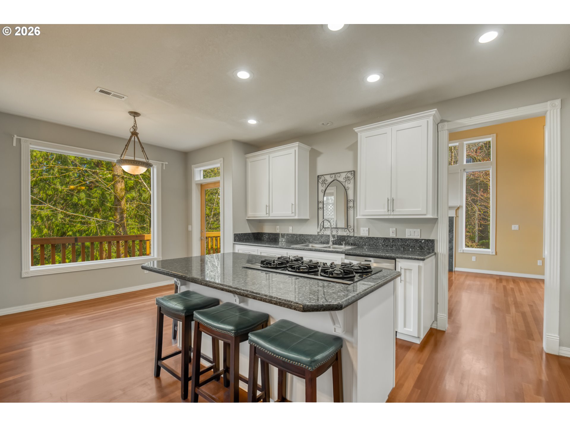 9583 Northwest Randall Lane Portland, OR 97229 - Photo 11 of 41 a kitchen with granite countertop sink stove and refrigerator
