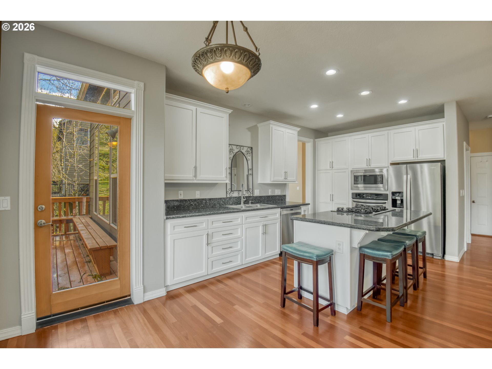 9583 Northwest Randall Lane Portland, OR 97229 - Photo 12 of 41 a kitchen with stainless steel appliances granite countertop a stove and a refrigerator