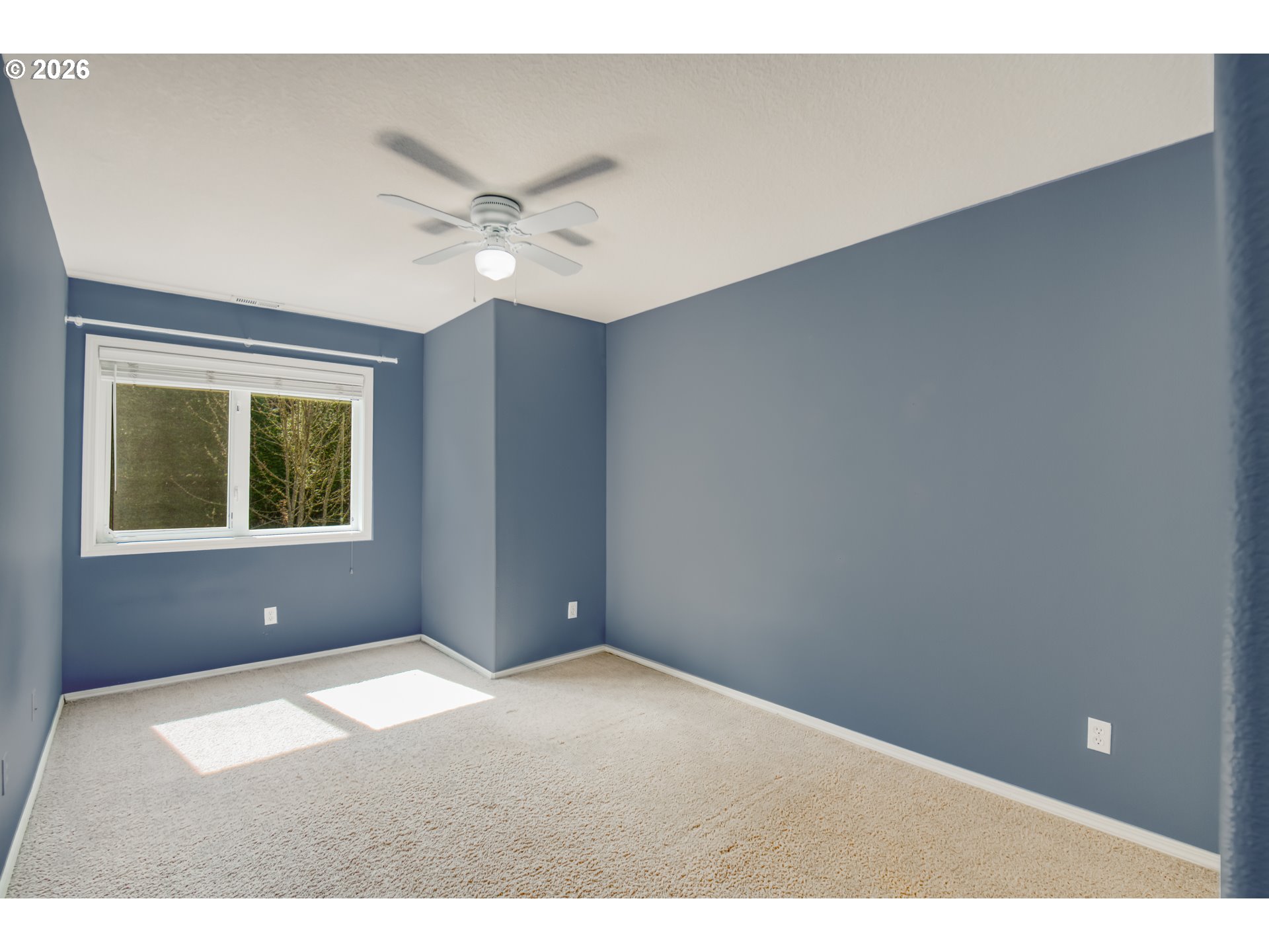 9583 Northwest Randall Lane Portland, OR 97229 - Photo 18 of 41 a view of an empty room with a window