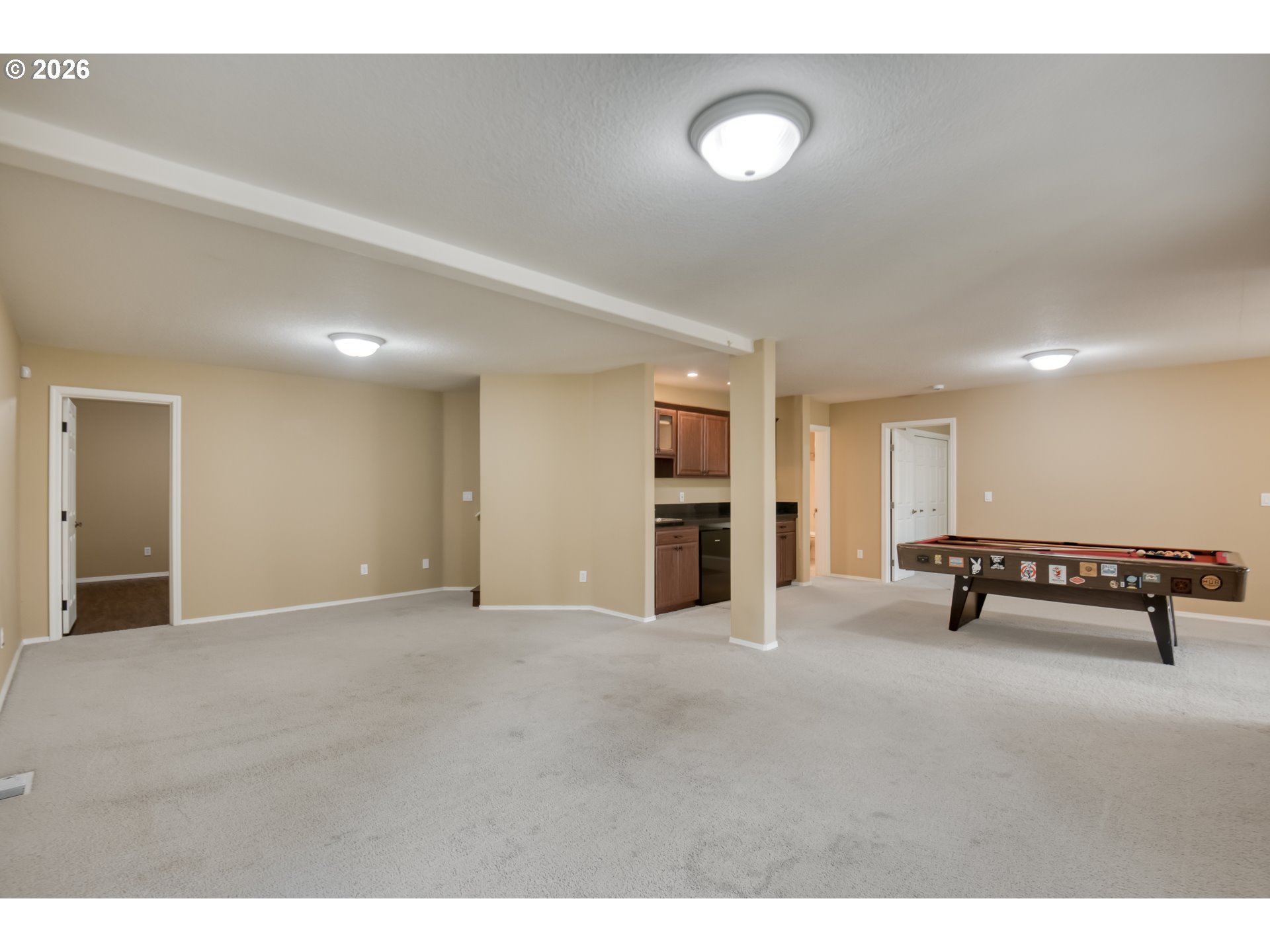 9583 Northwest Randall Lane Portland, OR 97229 - Photo 27 of 41 a view of an empty room with windows & cabinet