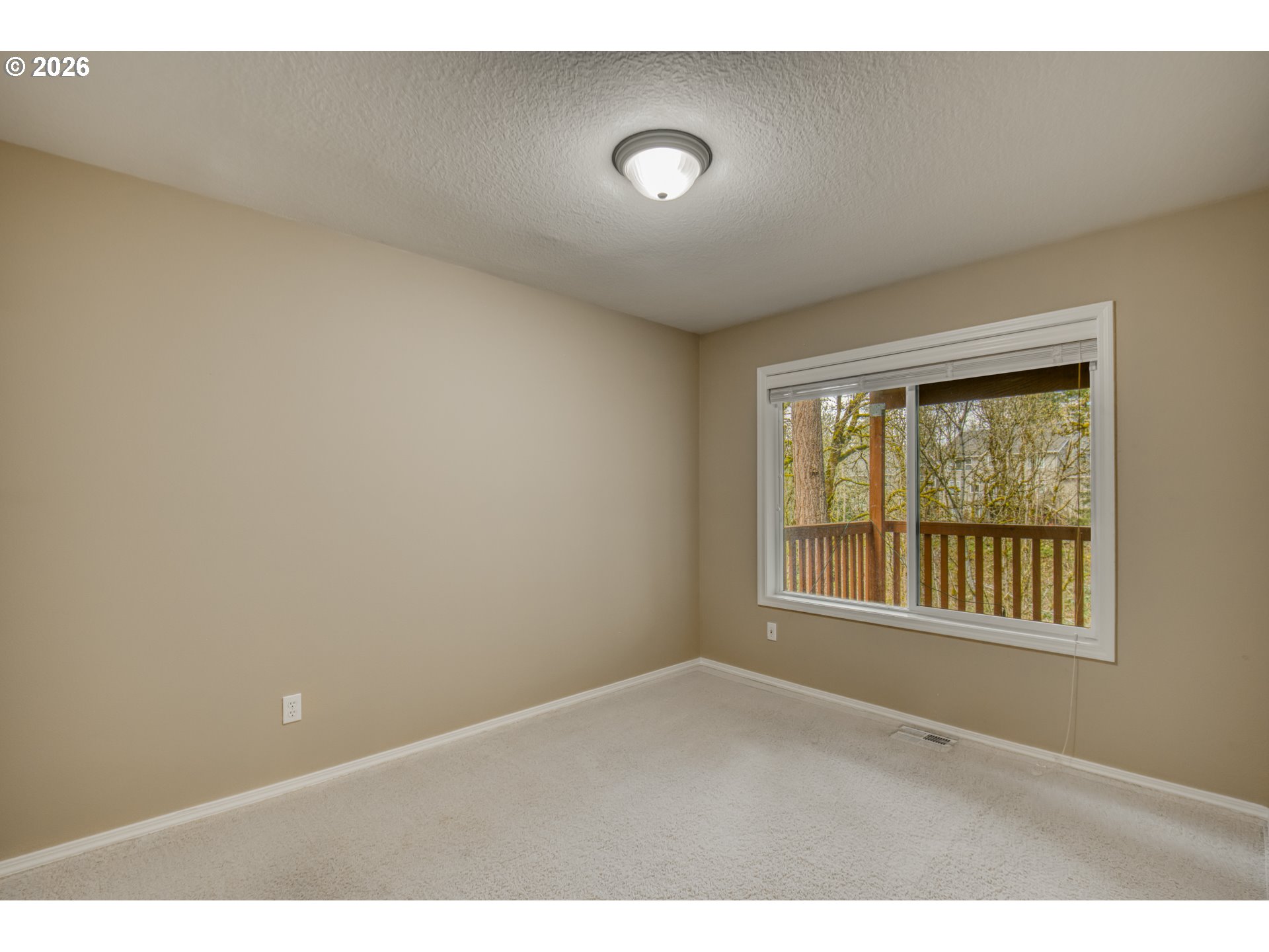 9583 Northwest Randall Lane Portland, OR 97229 - Photo 29 of 41 a view of an empty room with a window