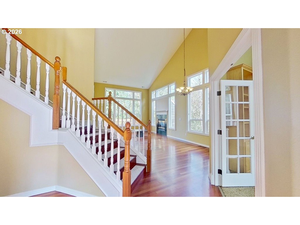 9583 Northwest Randall Lane Portland, OR 97229 - Photo 3 of 41 a view of a hallway with wooden floor